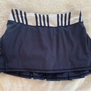 Lulu Lemon - Pace Setter Skort  size 4. Navy with white striped waistband